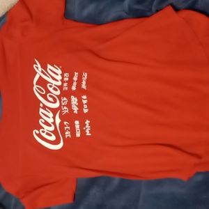 Coca cola shirt.